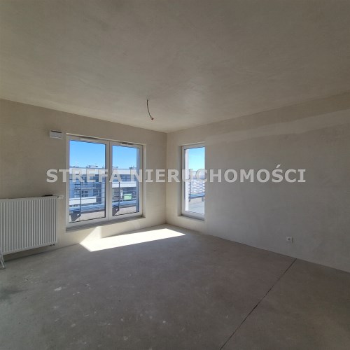 -salon z aneksem kuchennym i wyjściem na taras